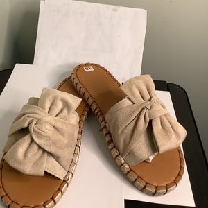 Beige Slide Ons with Bow Embellishment